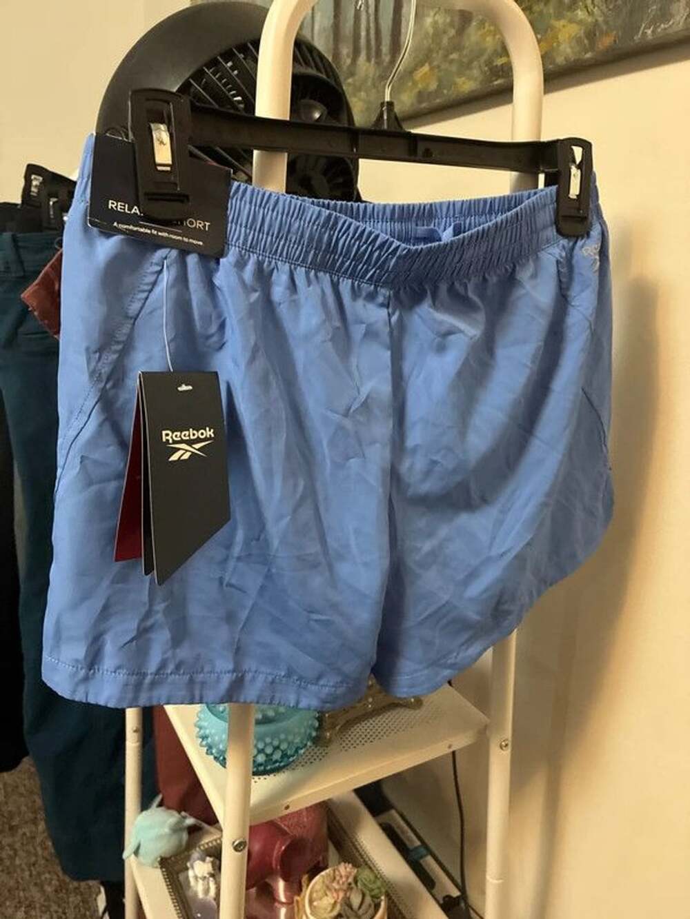 Women’s NWT Reebok blue running shorts built in brief loose fit xs